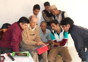 SocialEyes founder Nicholas Bedworth demonstrates a tablet in Nepal